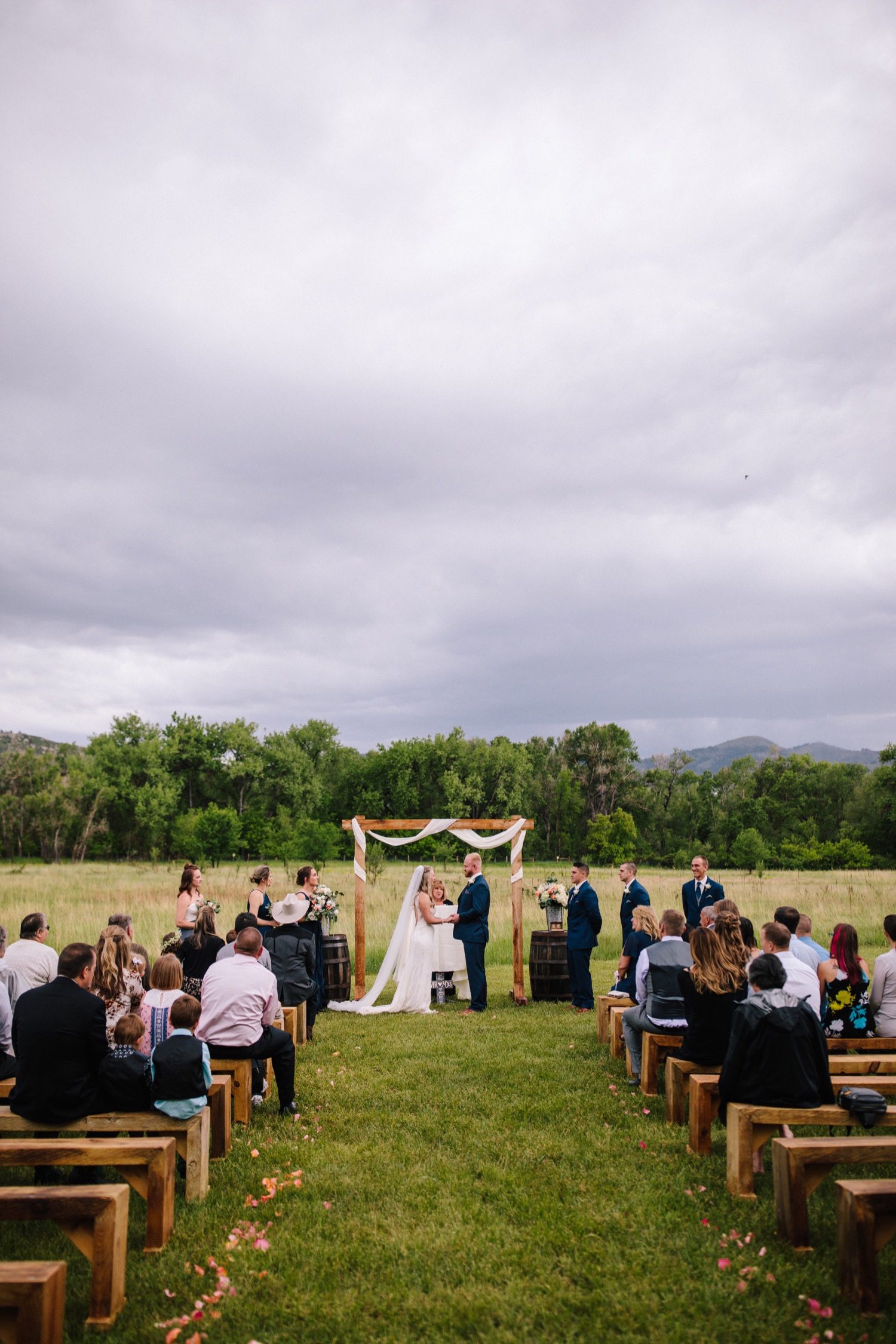 Rist Canyon Inn Wedding, Fort Collins Wedding, Colorado Wedding, Colorado Elopement, Colorado Mountain Wedding, Colorado Wedding Photographer, Colorado Elopement Photographer, Spring Wedding, Wedding Photography, Documentary Wedding Photography, Photojournalistic Wedding Photography, Wedding Inspiration, Wedding Ideas, Wedding Photos, Anna Be Wedding Dress, Compass Rose Floral, Cathedral Veil, Bride and Groom, Wedding Ceremony, Outdoor Wedding Ceremony, Wooden Altar, Wedding Arch with Tulle