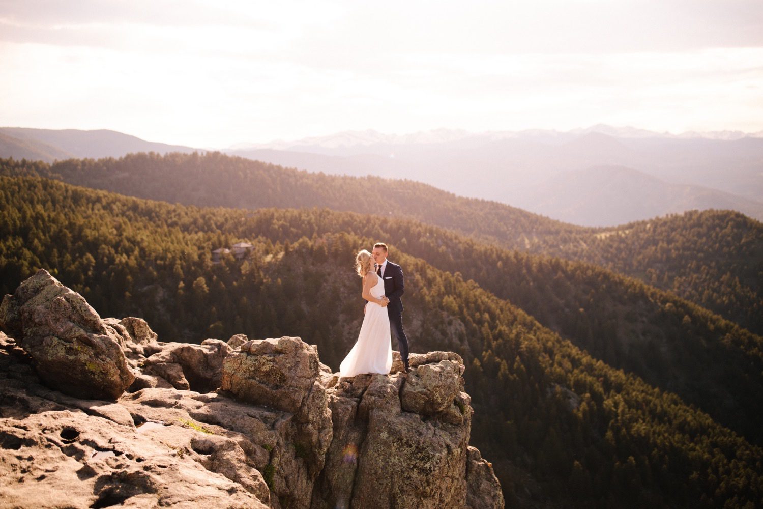 Bride and Groom kiss at Lost Gulch Overlook during sunset