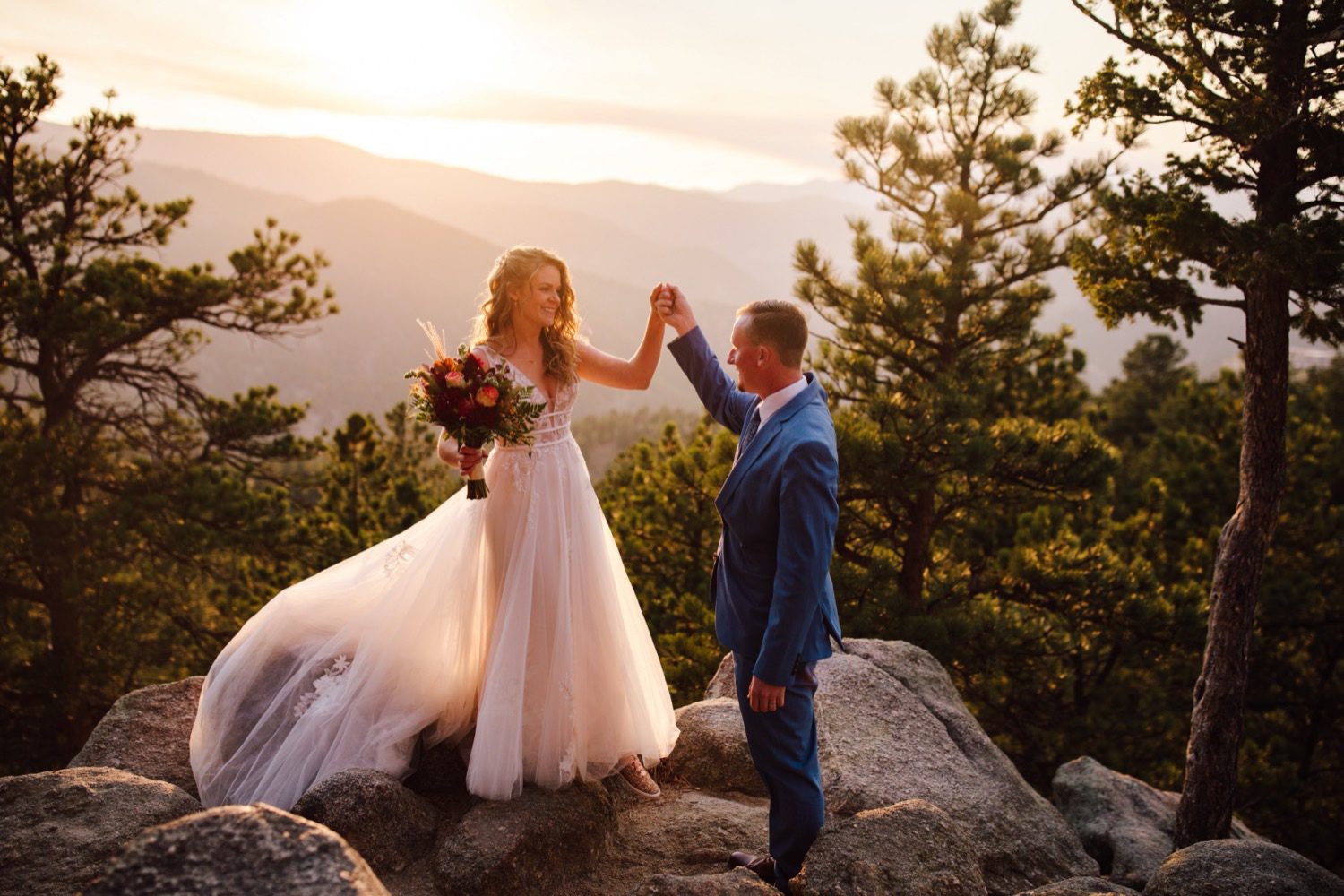 Bride and groom at sunset on Flagstaff Mountain in Boulder