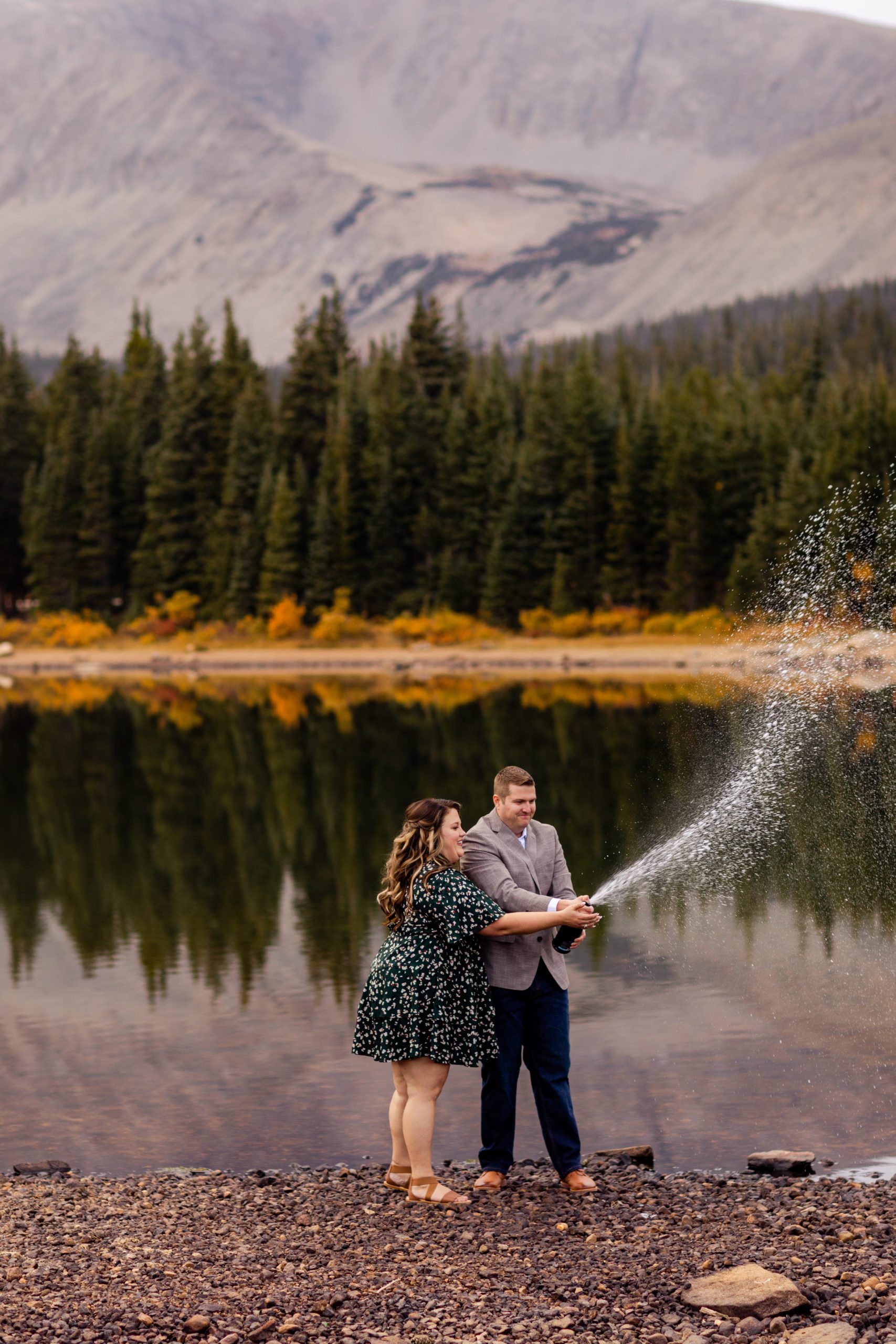 Champagne popping engagement photos, Colorado engagement photos, Brainard Lake Engagement Photos, Rocky Mountain Engagement Photos, Fall engagement photos, what to wear for engagement photos, engagement photo outfit inspiration, fall engagement photo outfits, mountain engagement photo ideas