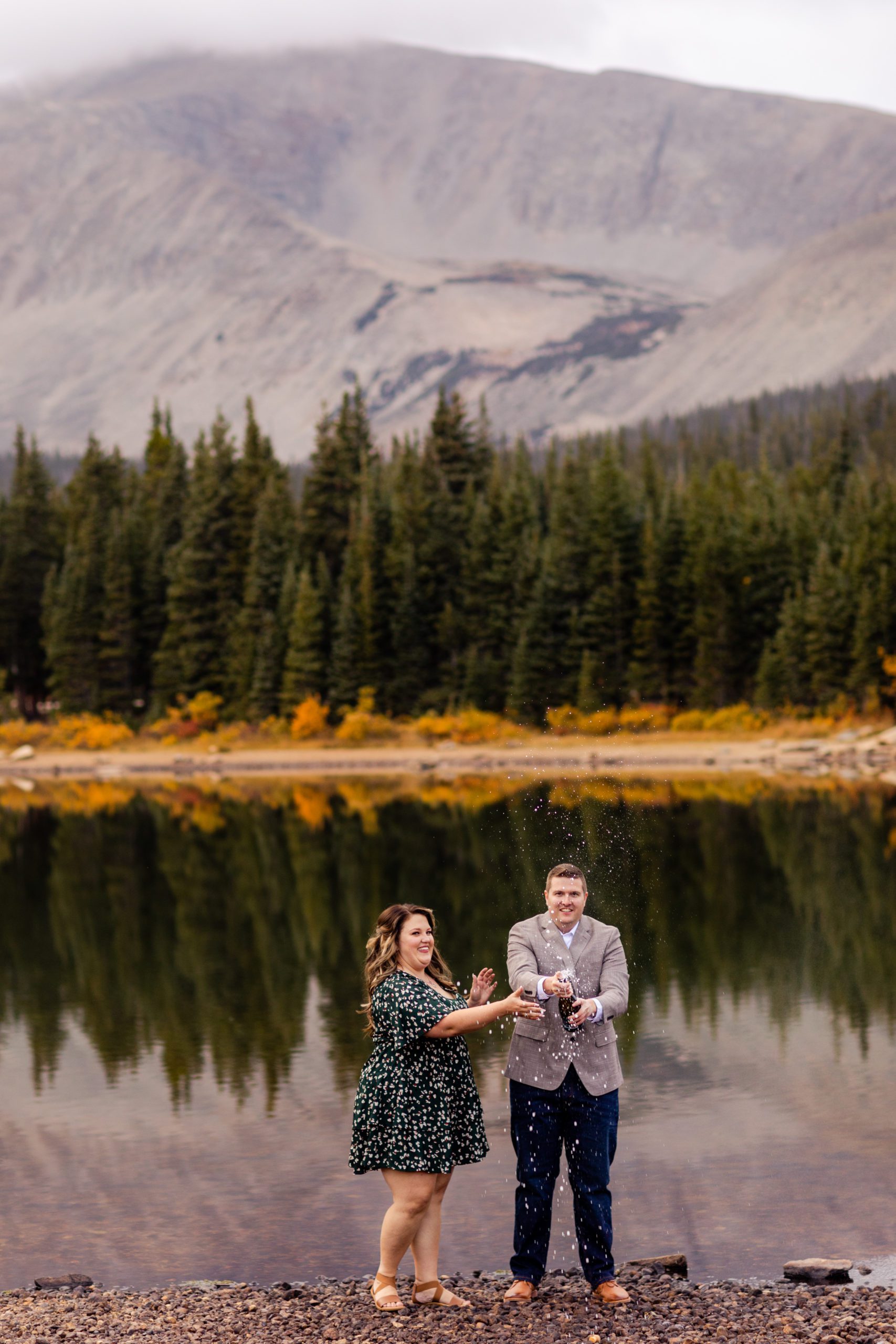 Champagne popping engagement photos, Colorado engagement photos, Brainard Lake Engagement Photos, Rocky Mountain Engagement Photos, Fall engagement photos, what to wear for engagement photos, engagement photo outfit inspiration, fall engagement photo outfits, mountain engagement photo ideas