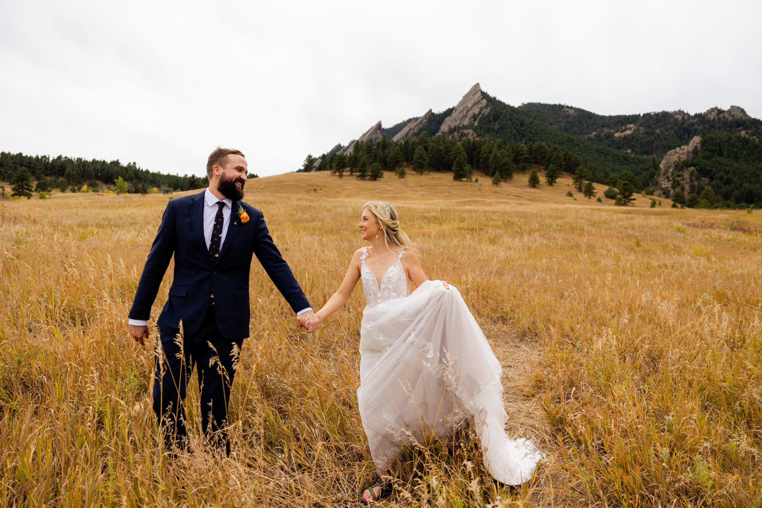 Bride and Groom walk along Chautauqua Trail in Boulder