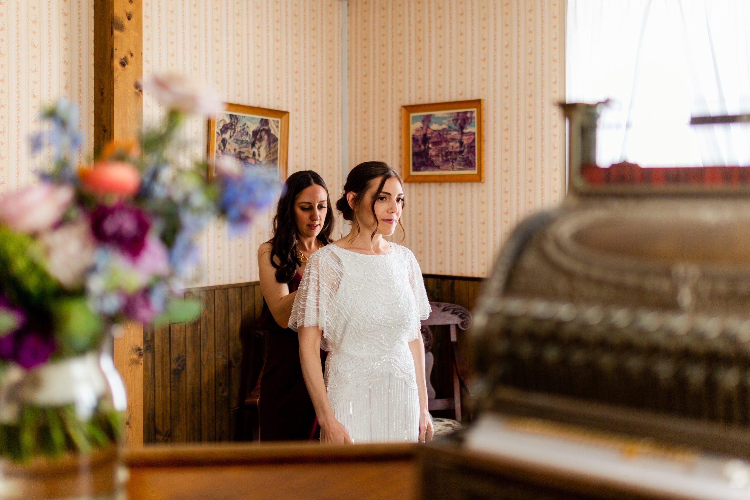 Bride getting ready at Bluebird Lodge before wedding ceremony at Gold Hill Inn Boulder