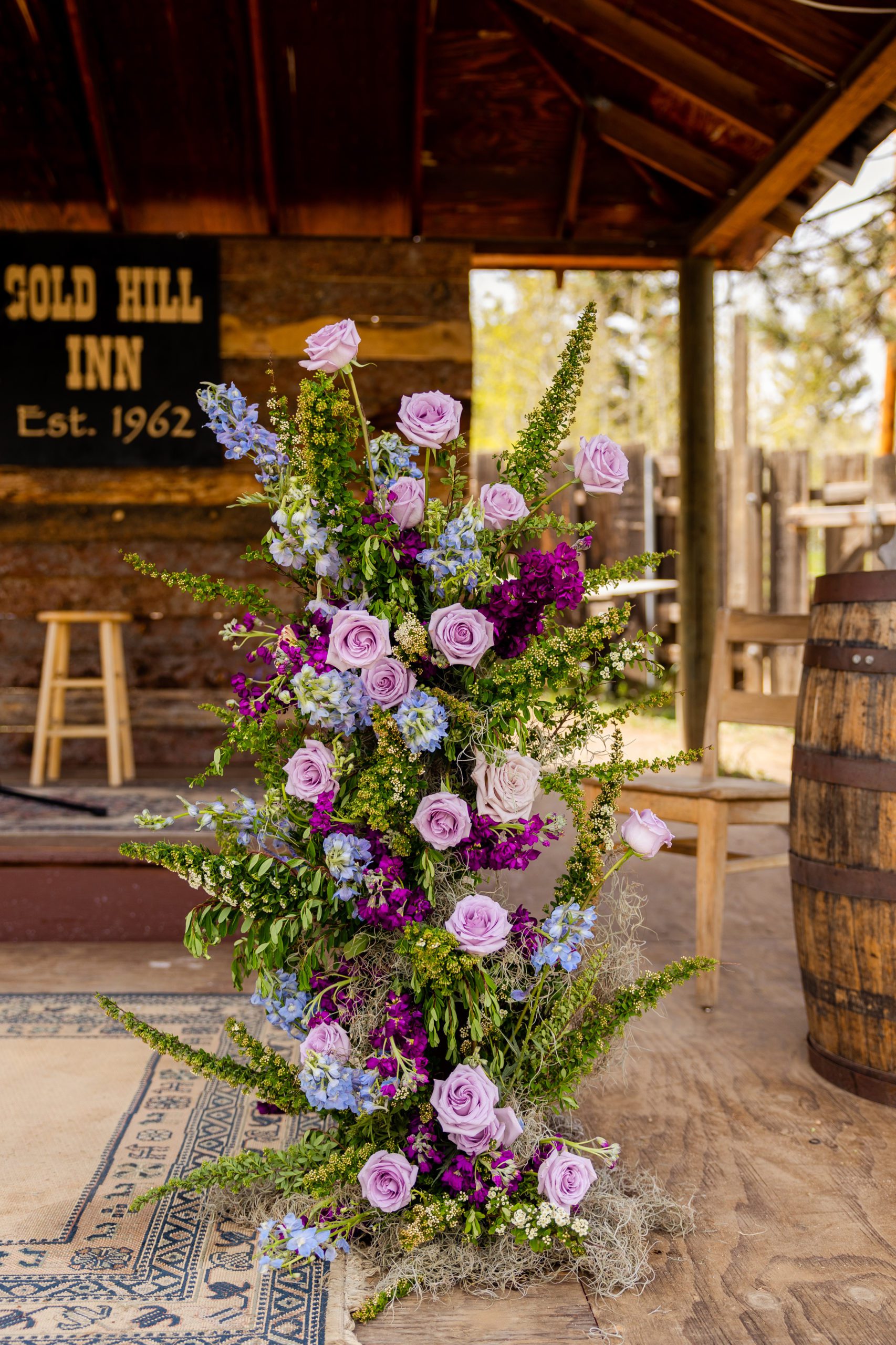 Wedding ceremony at Gold Hill Inn and Bluebird Lodge in Boulder Colorado with flowers by A Florae, Rocky Mountain Bride, Martha Stewart Weddings
