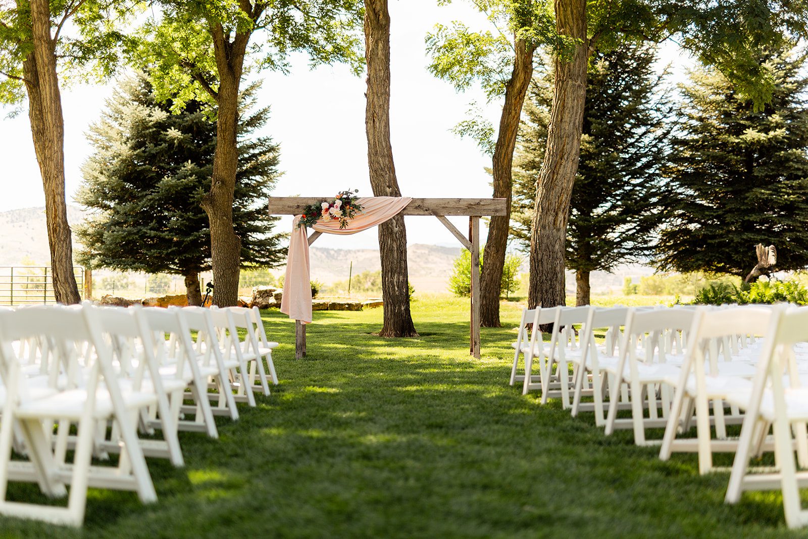 A symmetrical floral altar, wedding altar, wedding arch, faux wedding flowers, Lings moment, fake wedding flowers, wedding ceremony at Shupe Homestead 