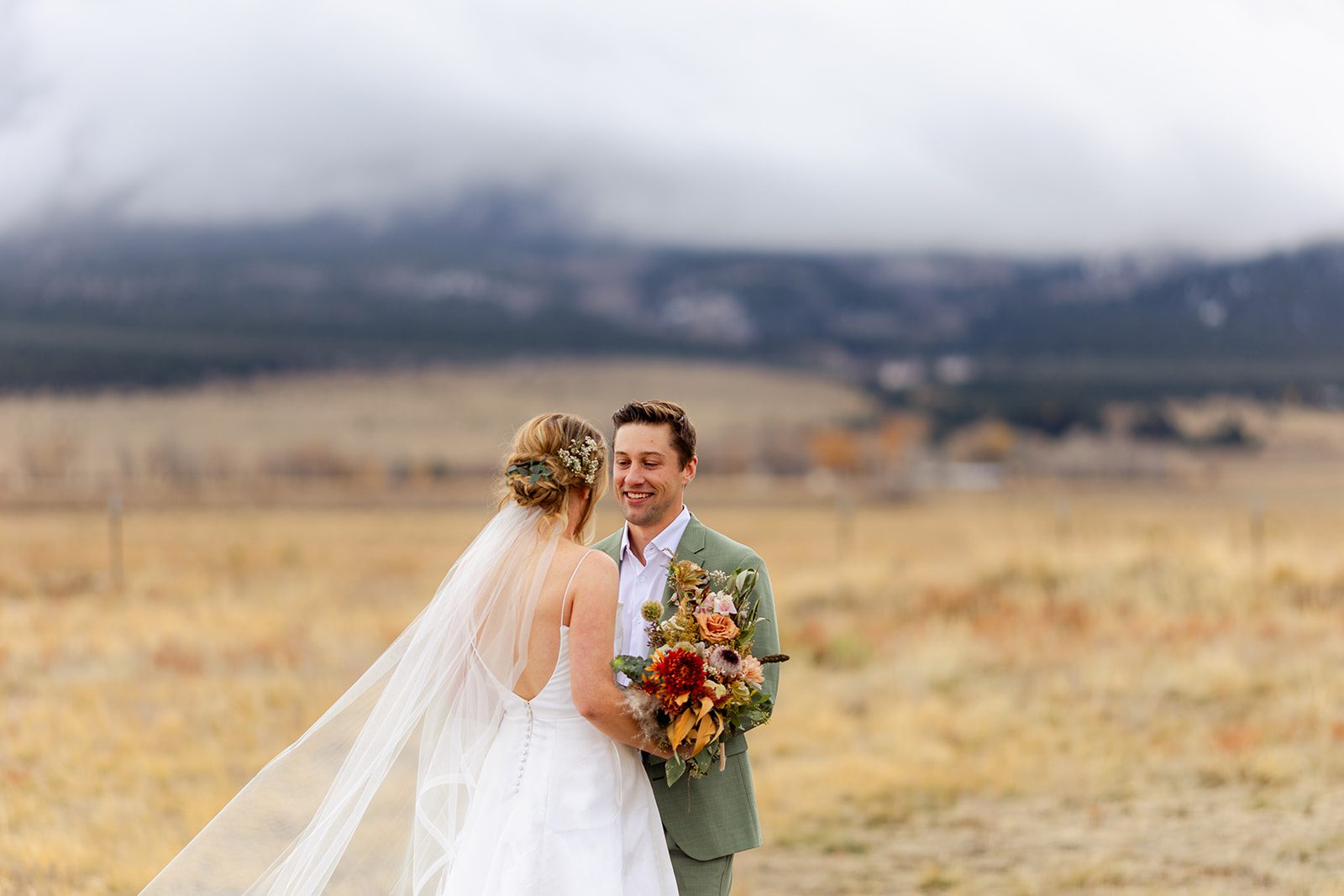 First look at The Barn at Sunset Ranch in Buena Vista Colorado, Bride hair, Bridal updo with flowers, bride wedding hair idea